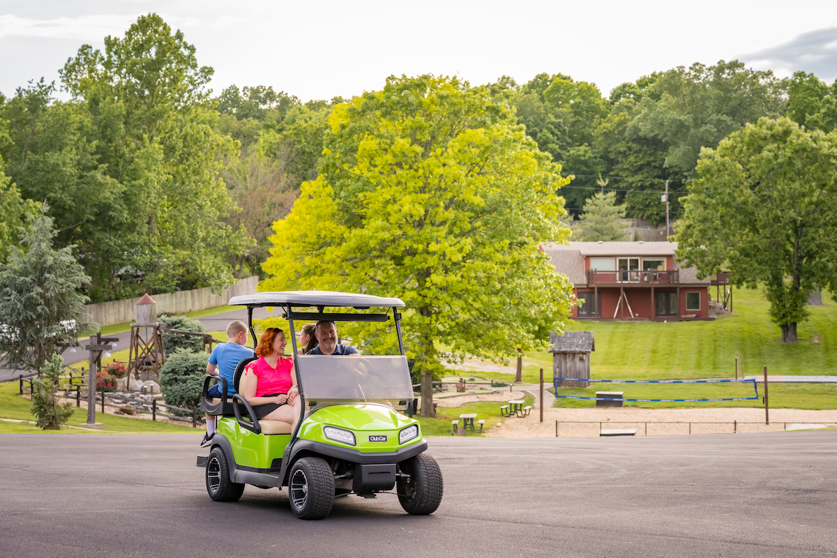Guests riding a golf cart at Chalets on Table Rock Lake