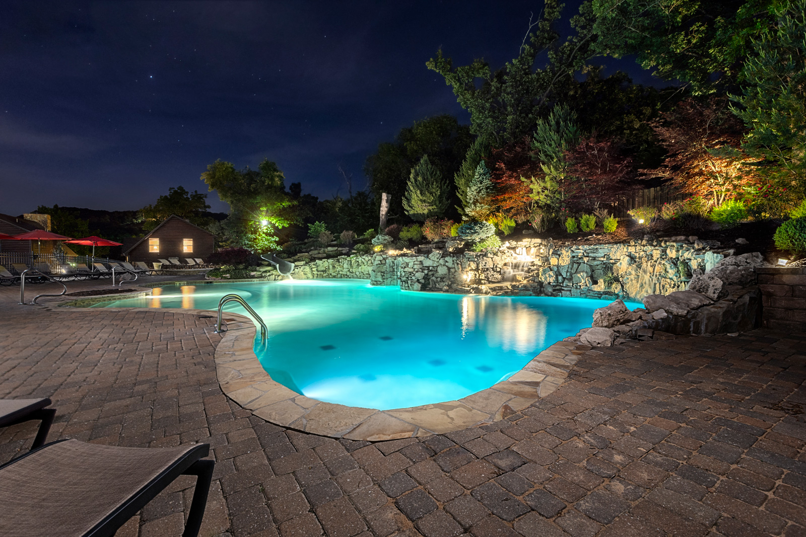 The illuminated grotto pool at Chalets on Table Rock Lake at night